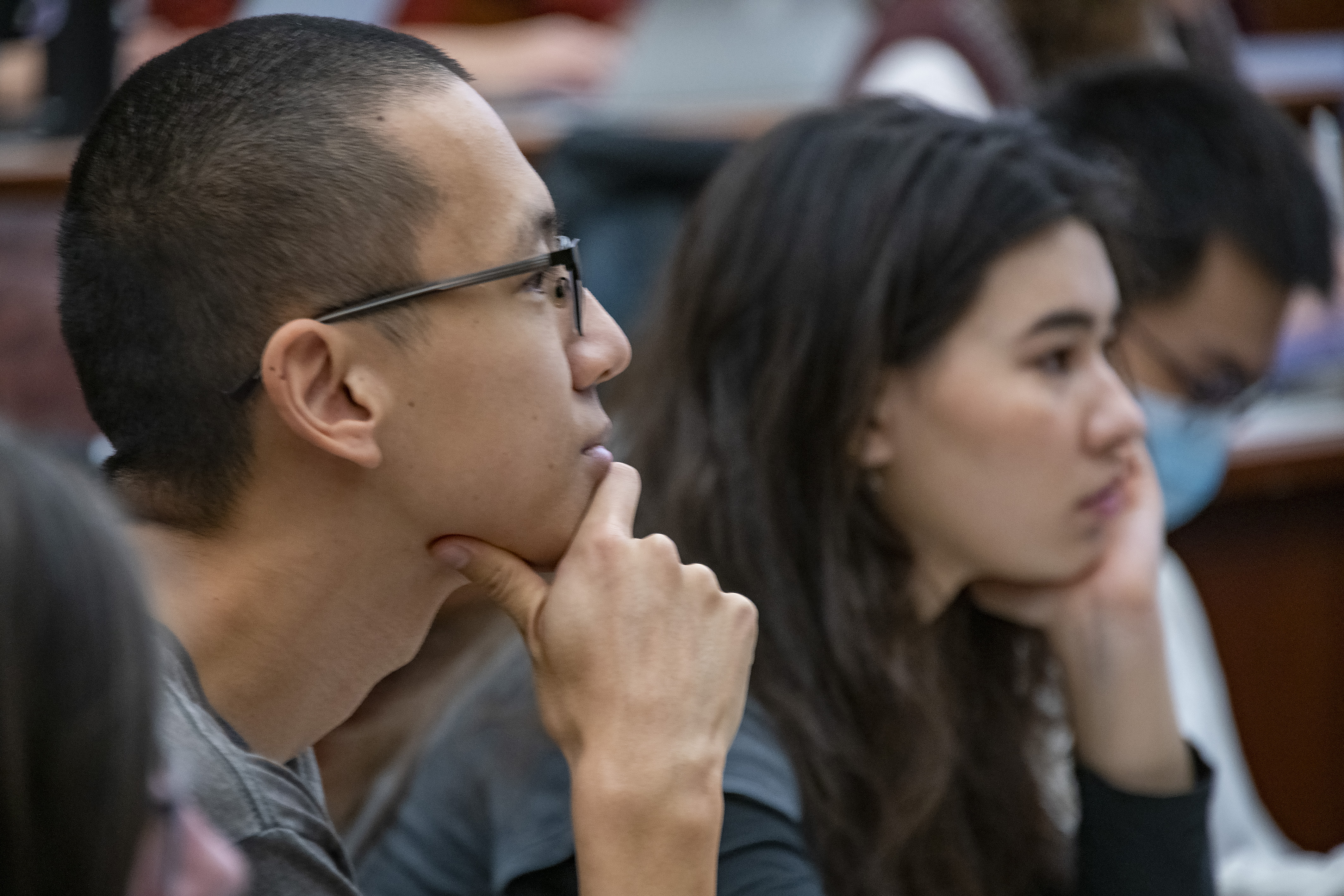 Two students sitting in on a history major lecture