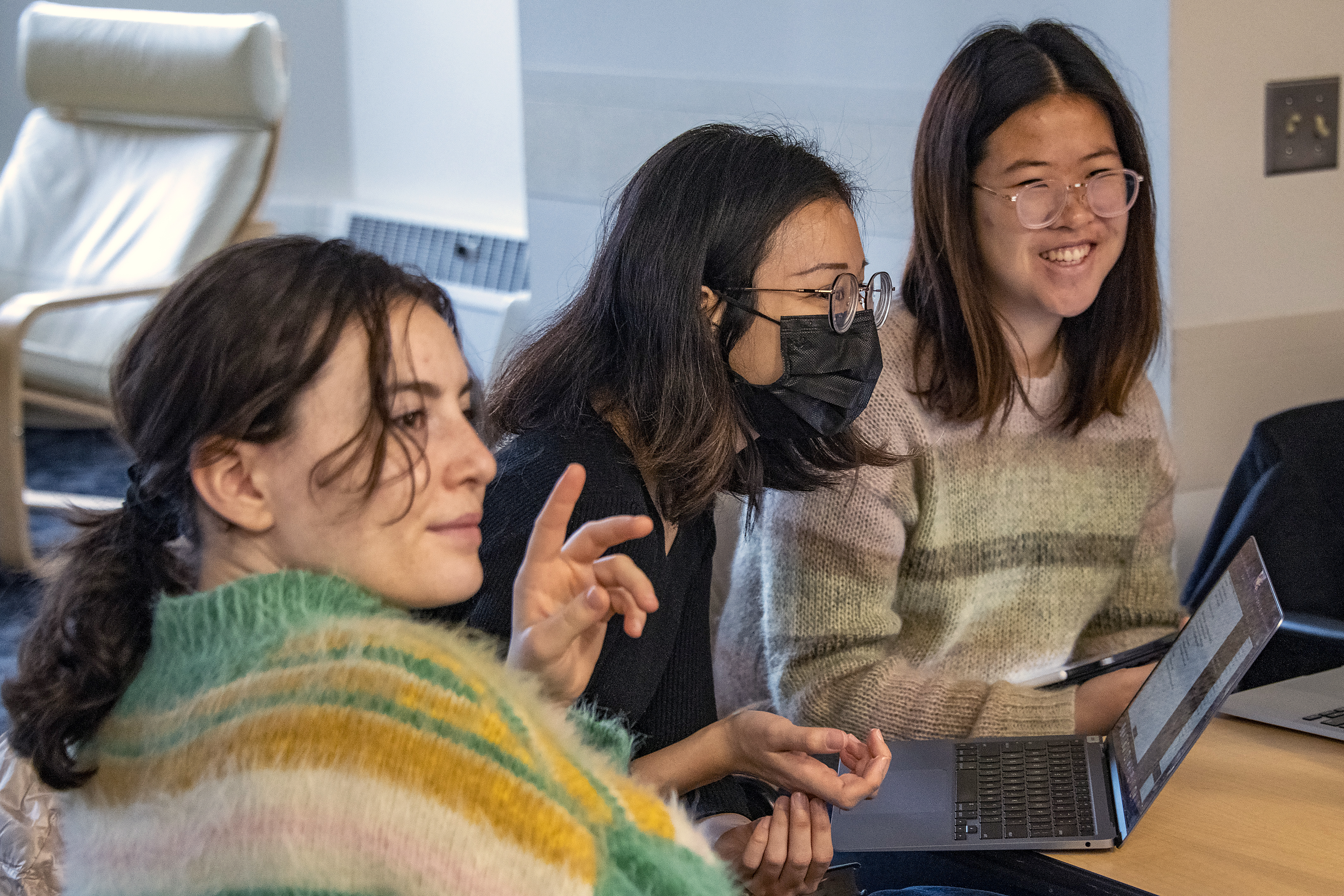 three women in a classroom.
